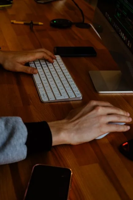 Laptop on a desk showing the Pexels homepage, highlighting its web interface.